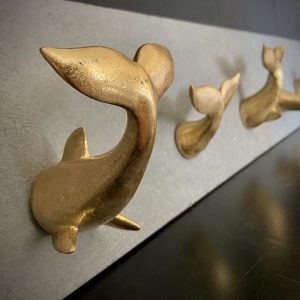 RESIN GOLD-LEAF WHALE TAIL ON CEMENT PANEL,39x5x8"